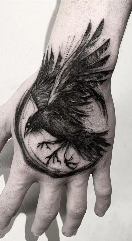 Crow hand tattoo