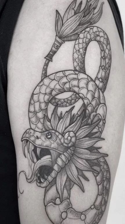 Black And Grey Quetzalcoatl Tattoo
